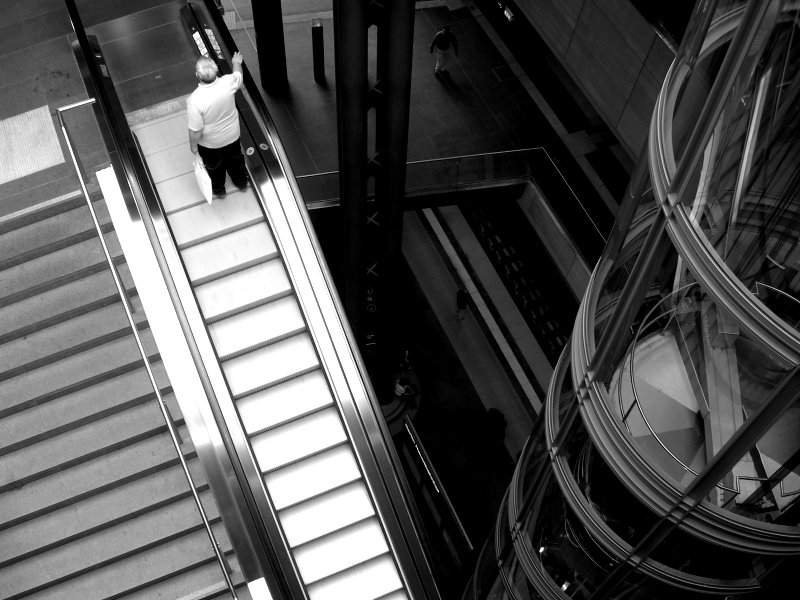 man on an escalator